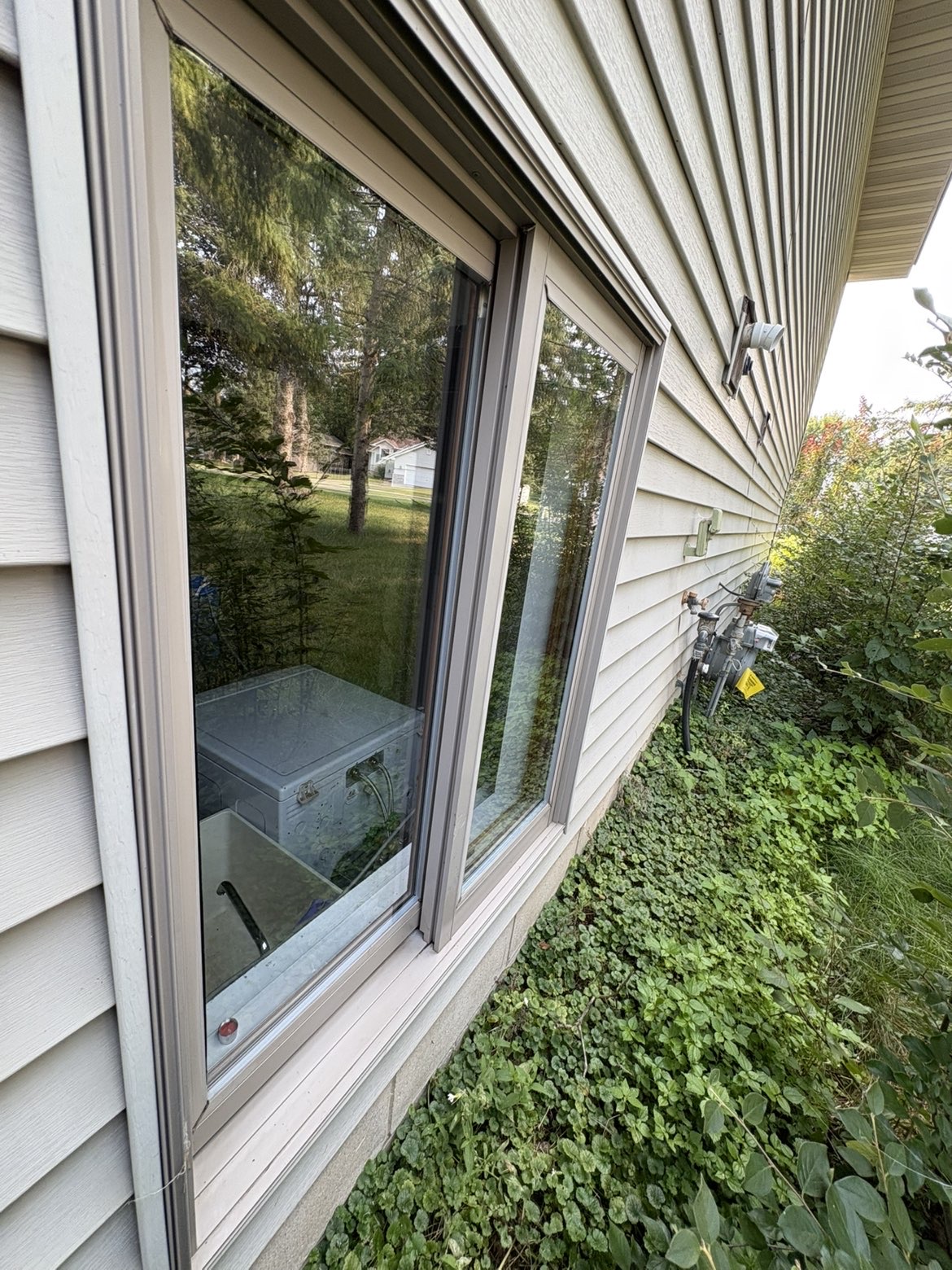 Exterior window frame after cobweb removal and cleaning